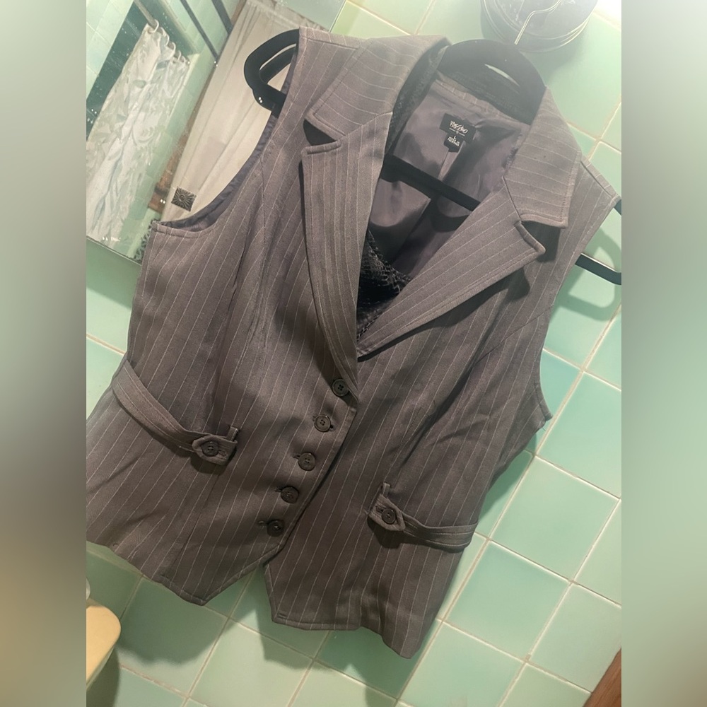 Grey vest. Cute to dress up.